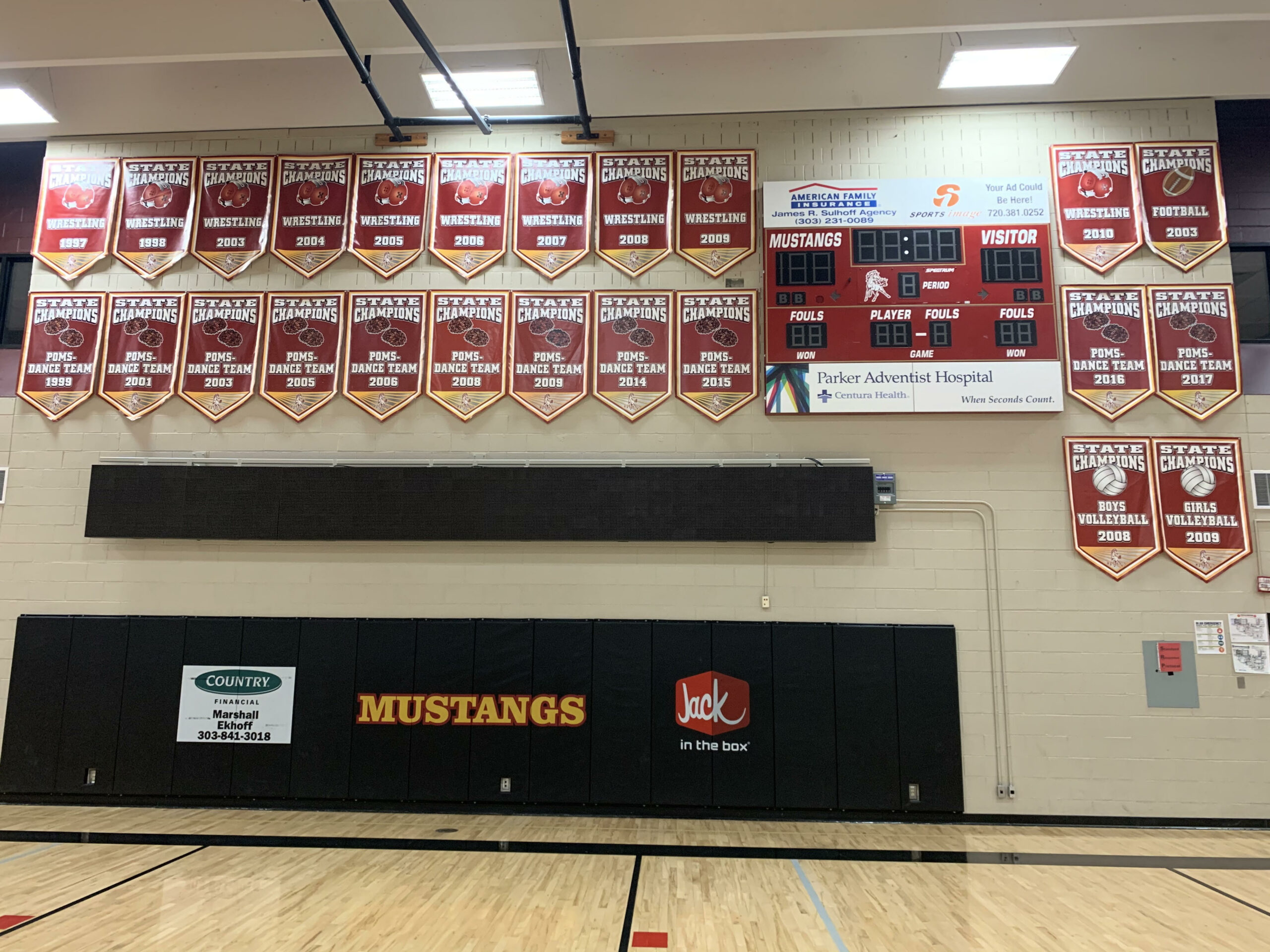Wall of State Championship Awards for Mustangs in multiple sports