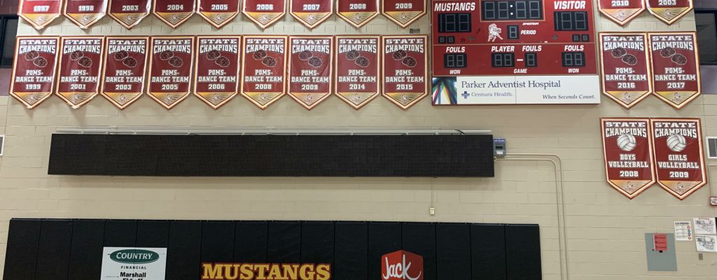 Wall of State Championship Awards for Mustangs in multiple sports