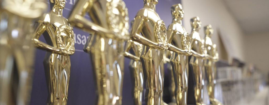 a row of student filmmaking trophy awards at Ballard High School